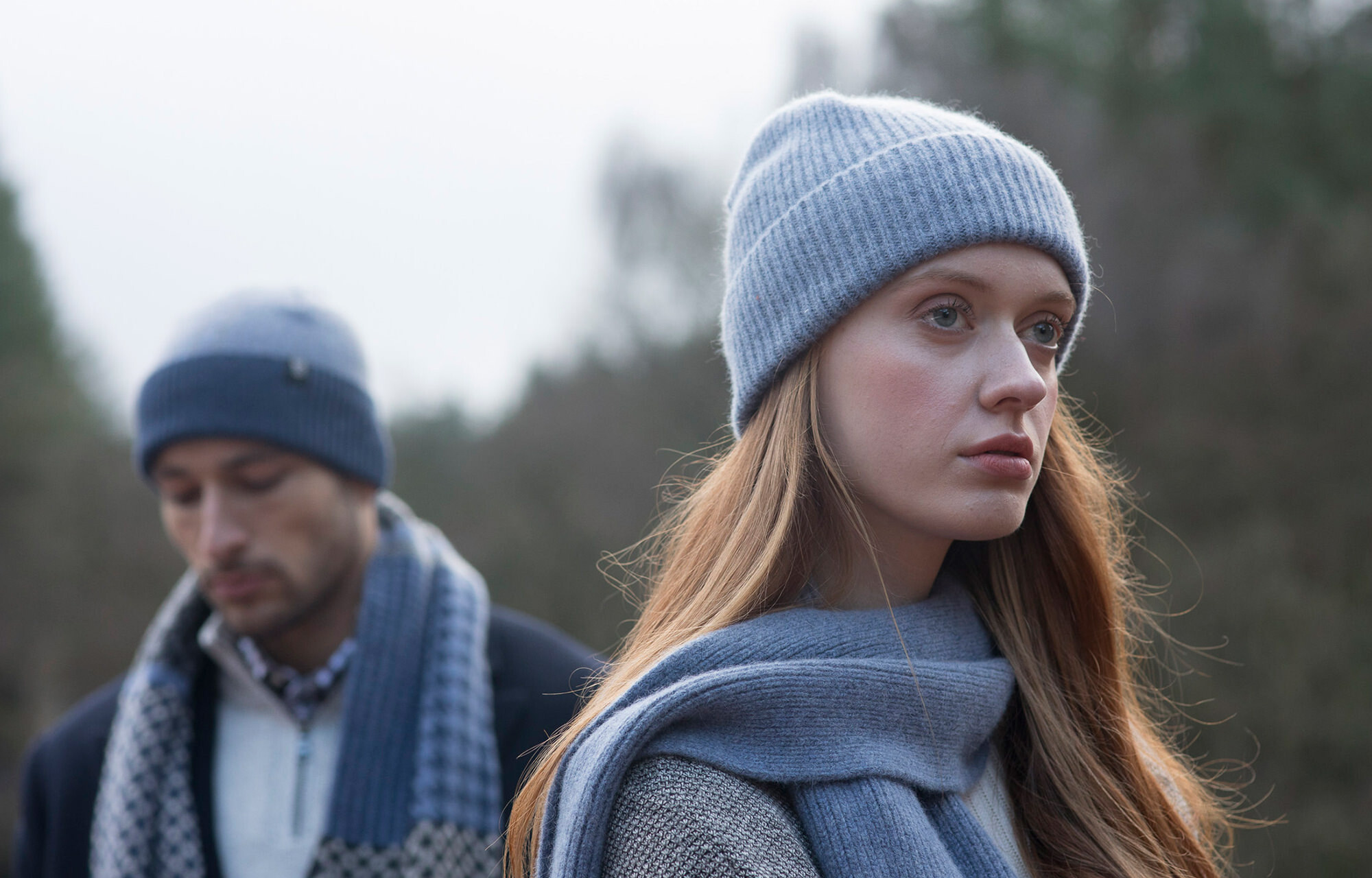 Man and woman wearing Robert Mackie knitwear