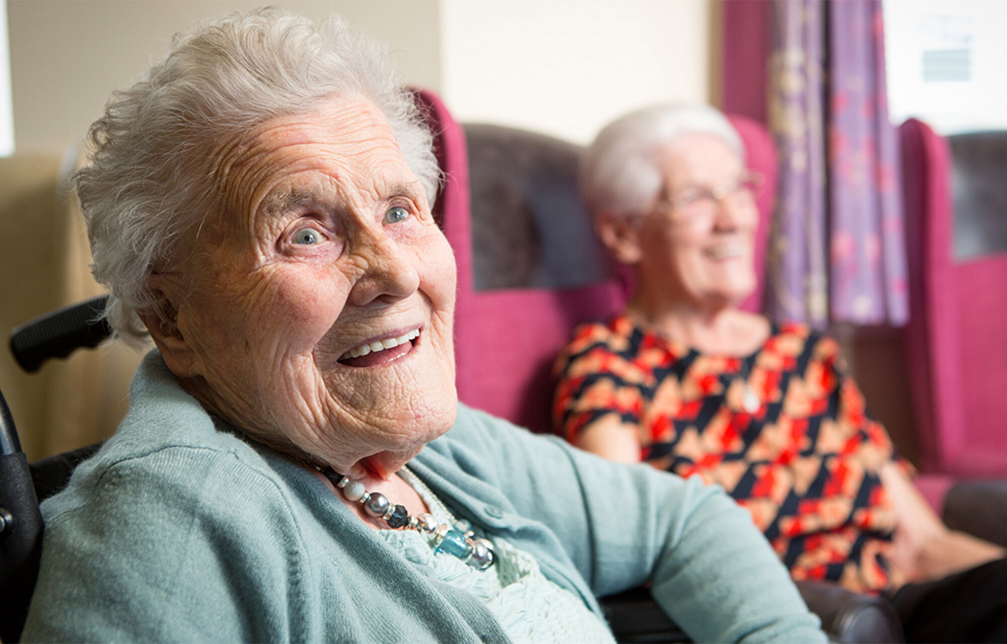 Women smiling in a care home